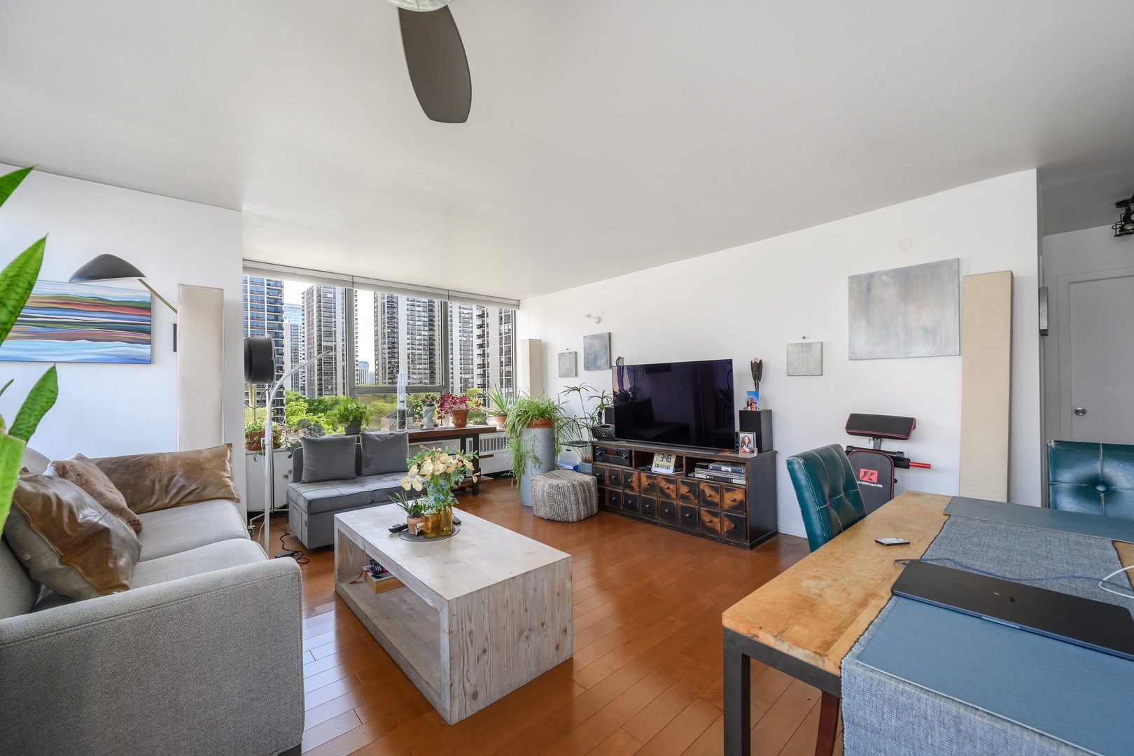 70 West Burton Place, Unit 705 Chicago, IL 60610 - Photo 7 of 17 a living room with furniture and a flat screen tv