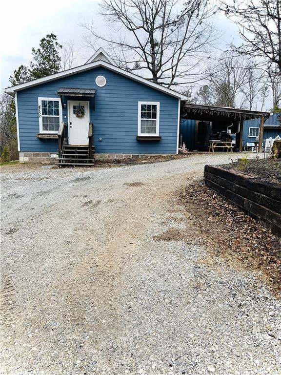 a house view with a backyard space