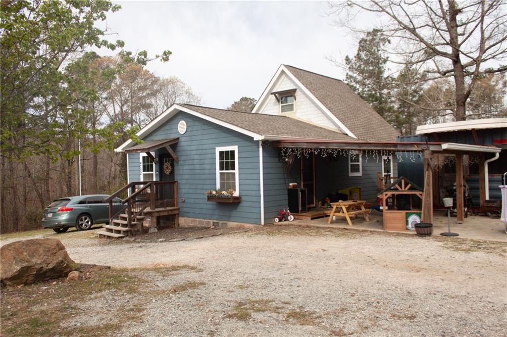 a view of a outdoor space with patio furniture and garden