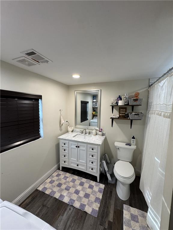 4752 County Line Road Mansfield, GA 30055 - Photo 13 of 15 a bathroom with a sink a toilet and mirror