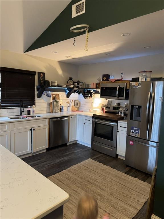 4752 County Line Road Mansfield, GA 30055 - Photo 2 of 15 a kitchen with kitchen island a sink appliances and cabinets