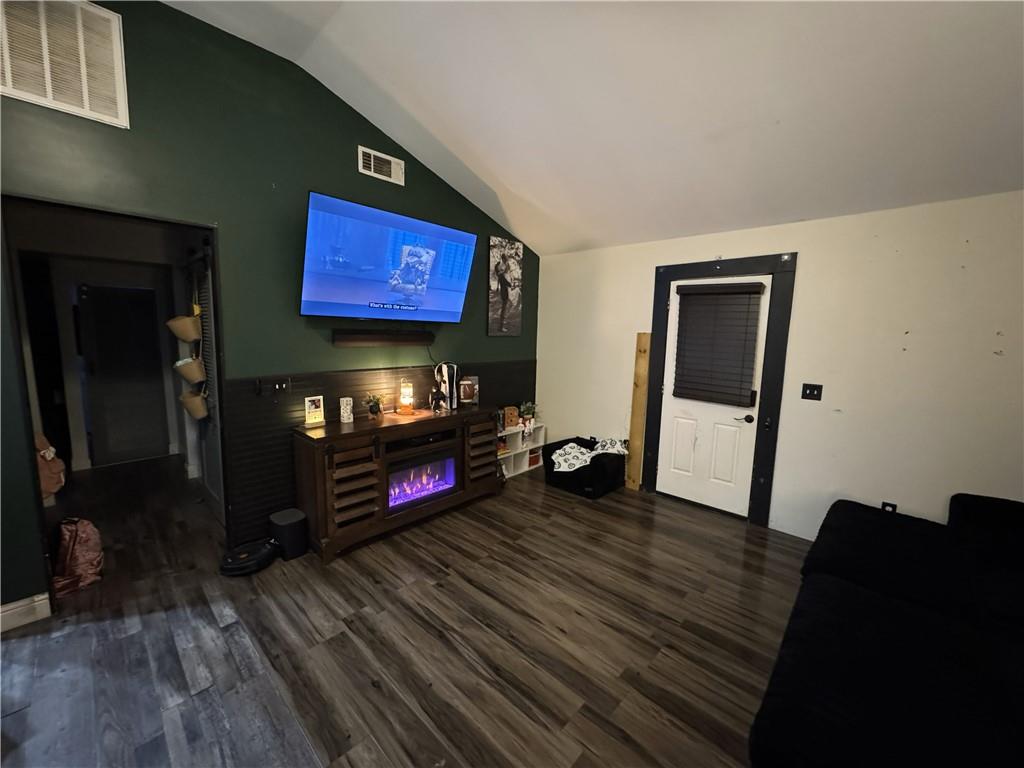 4752 County Line Road Mansfield, GA 30055 - Photo 4 of 15 a living room with furniture and a flat screen tv