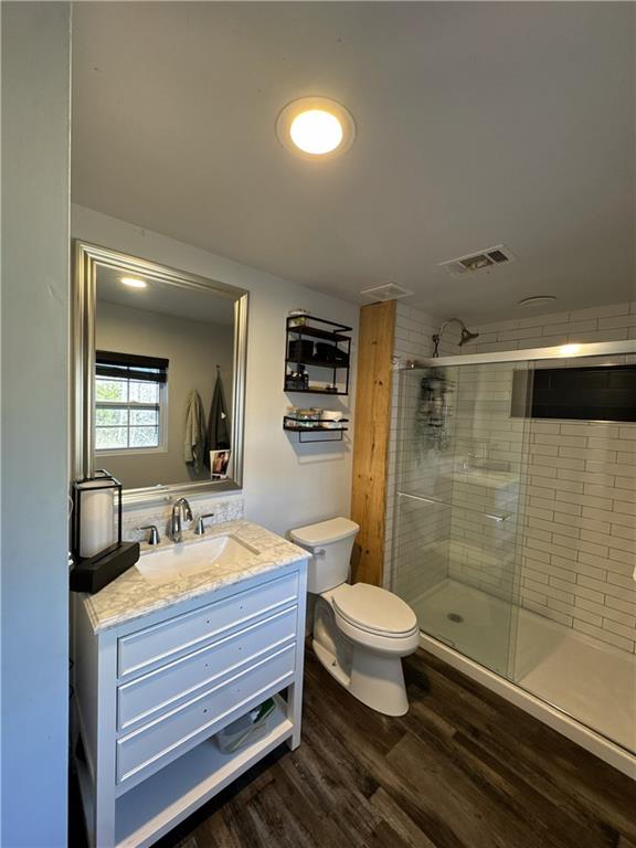4752 County Line Road Mansfield, GA 30055 - Photo 9 of 15 a bathroom with a toilet a sink and shower