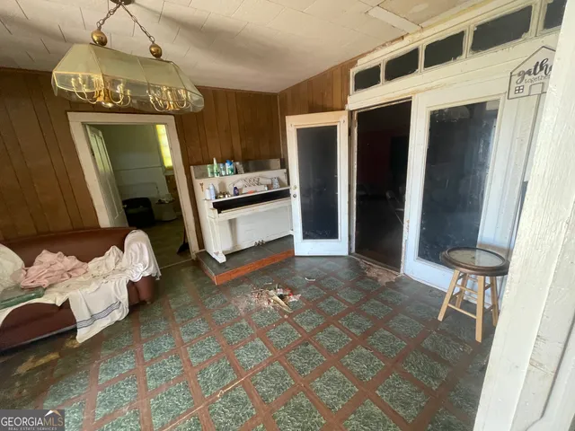 a view of living room with furniture and a fireplace