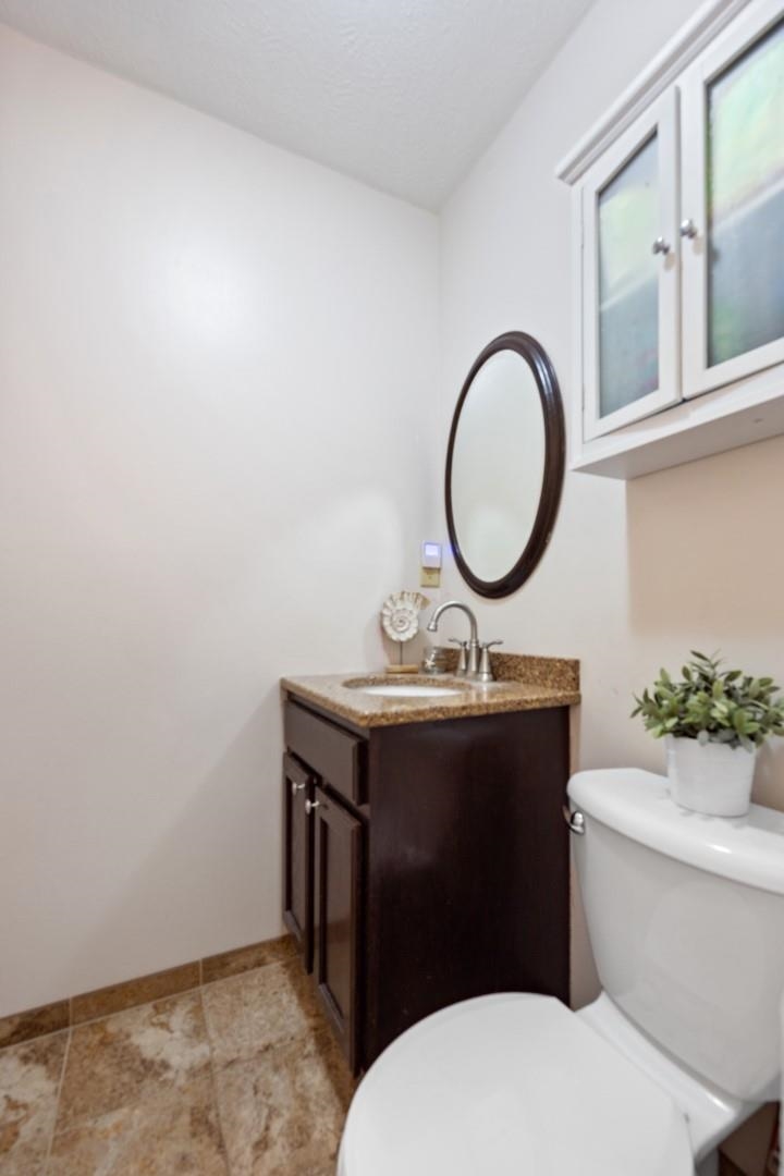 5568 Gray Eagle Road Roscoe, IL 61073 - Photo 17 of 45 a bathroom with a toilet a sink and a mirror