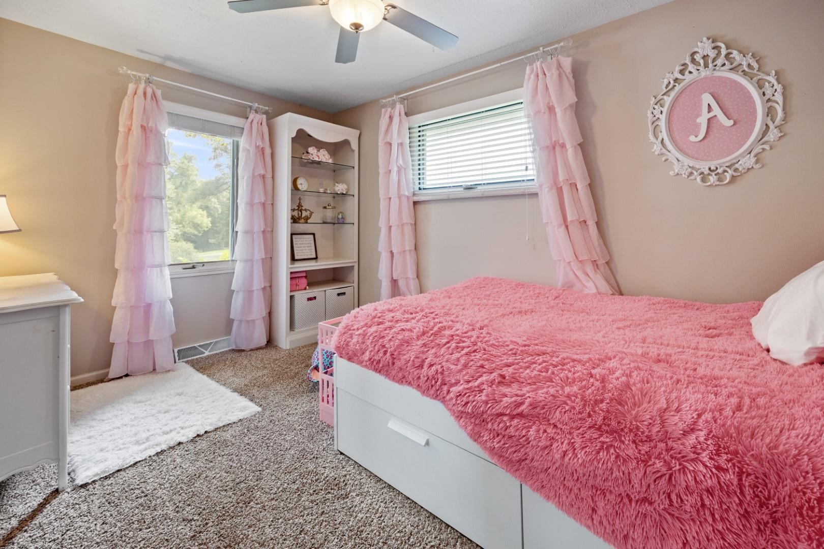 5568 Gray Eagle Road Roscoe, IL 61073 - Photo 19 of 45 a spacious bedroom with a bed and a window