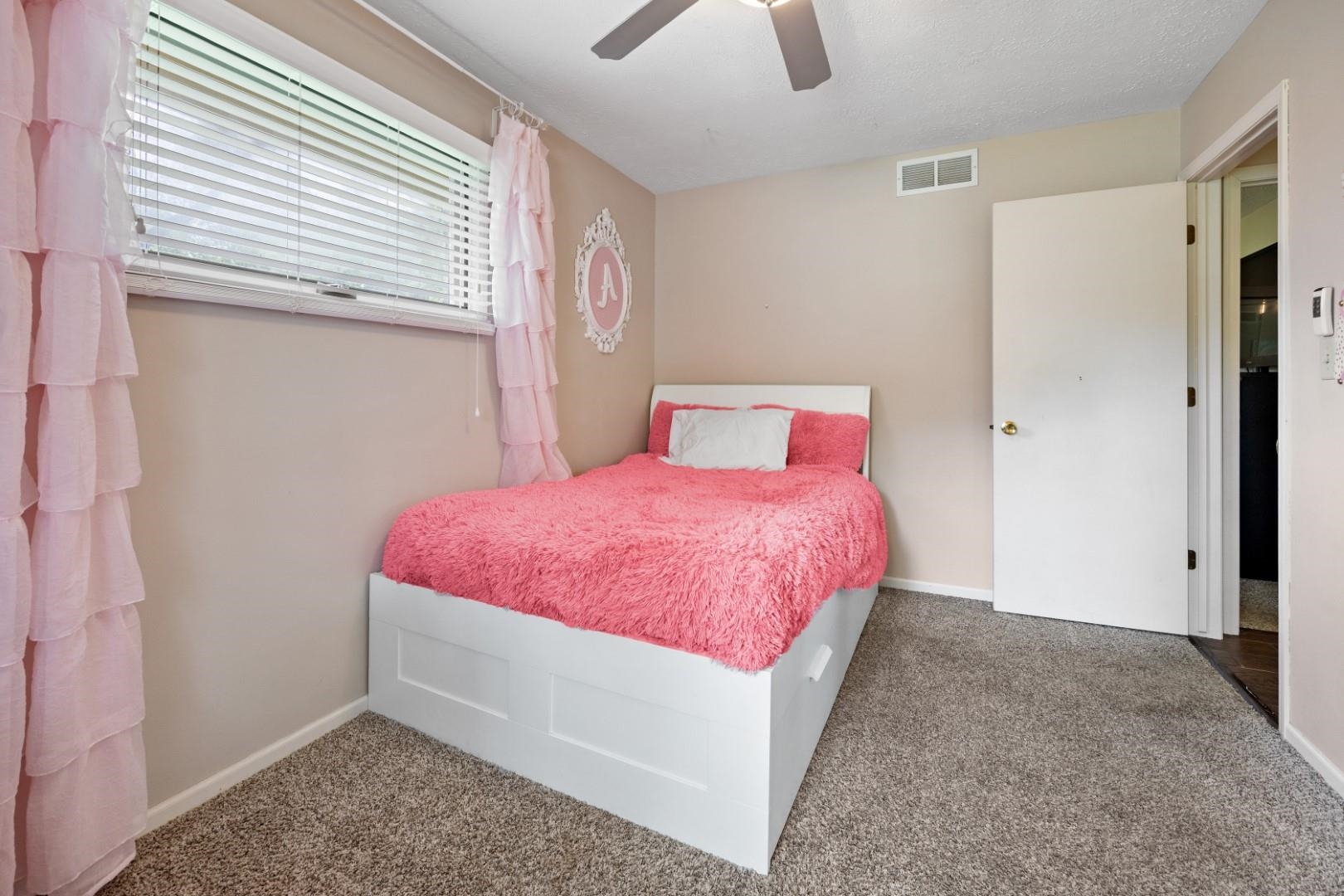 5568 Gray Eagle Road Roscoe, IL 61073 - Photo 20 of 45 a spacious bedroom with a bed and a window