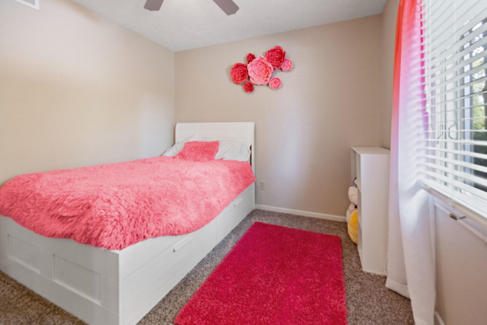 5568 Gray Eagle Road Roscoe, IL 61073 - Photo 23 of 45 a bed room with a bed and a couch