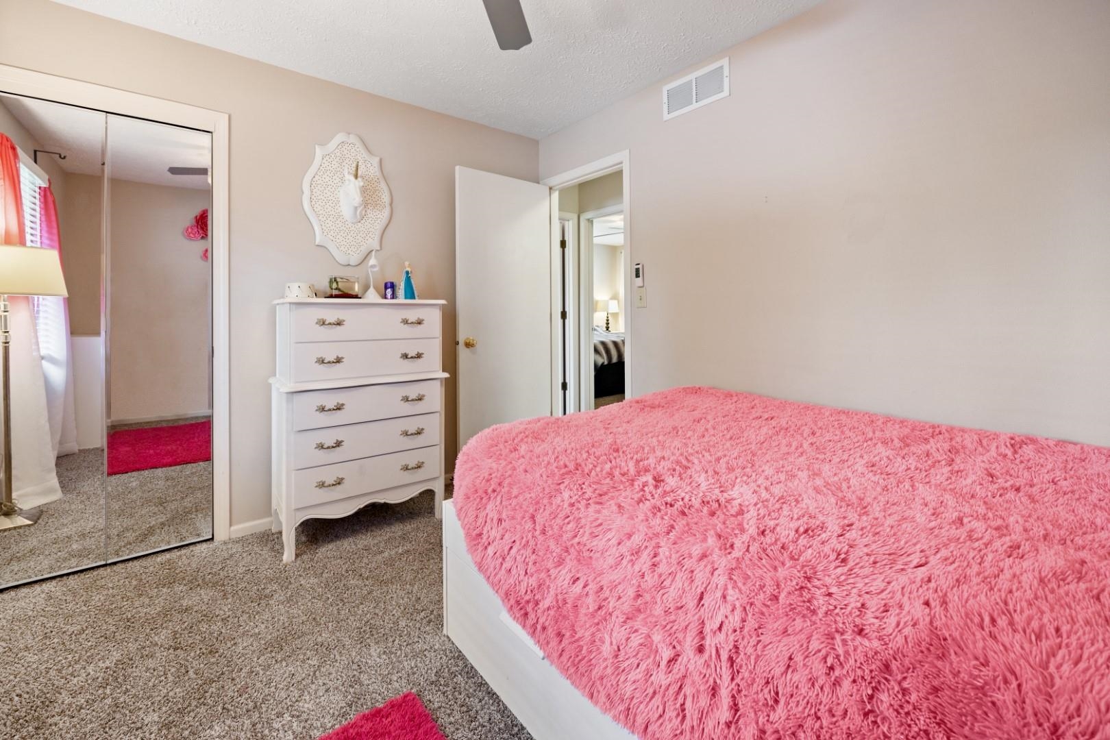 5568 Gray Eagle Road Roscoe, IL 61073 - Photo 24 of 45 a bedroom with a bed and a cabinets