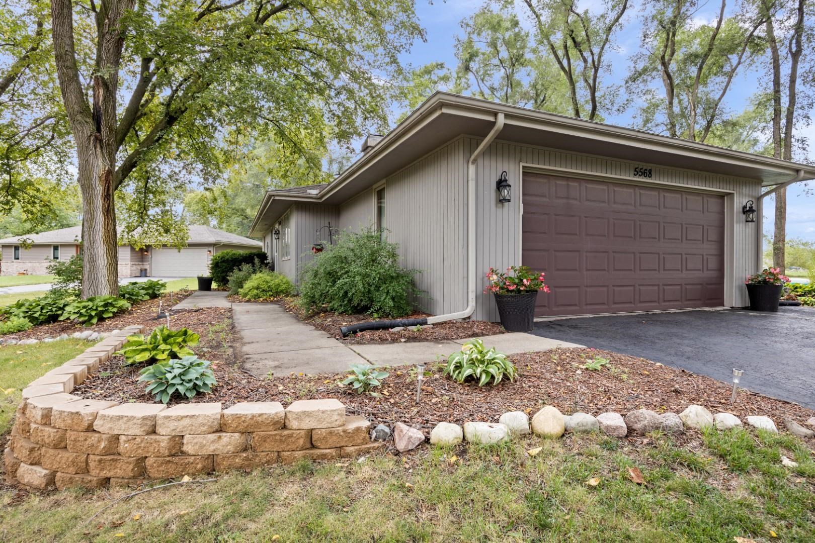 5568 Gray Eagle Road Roscoe, IL 61073 - Photo 3 of 45 a front view of a house with a yard