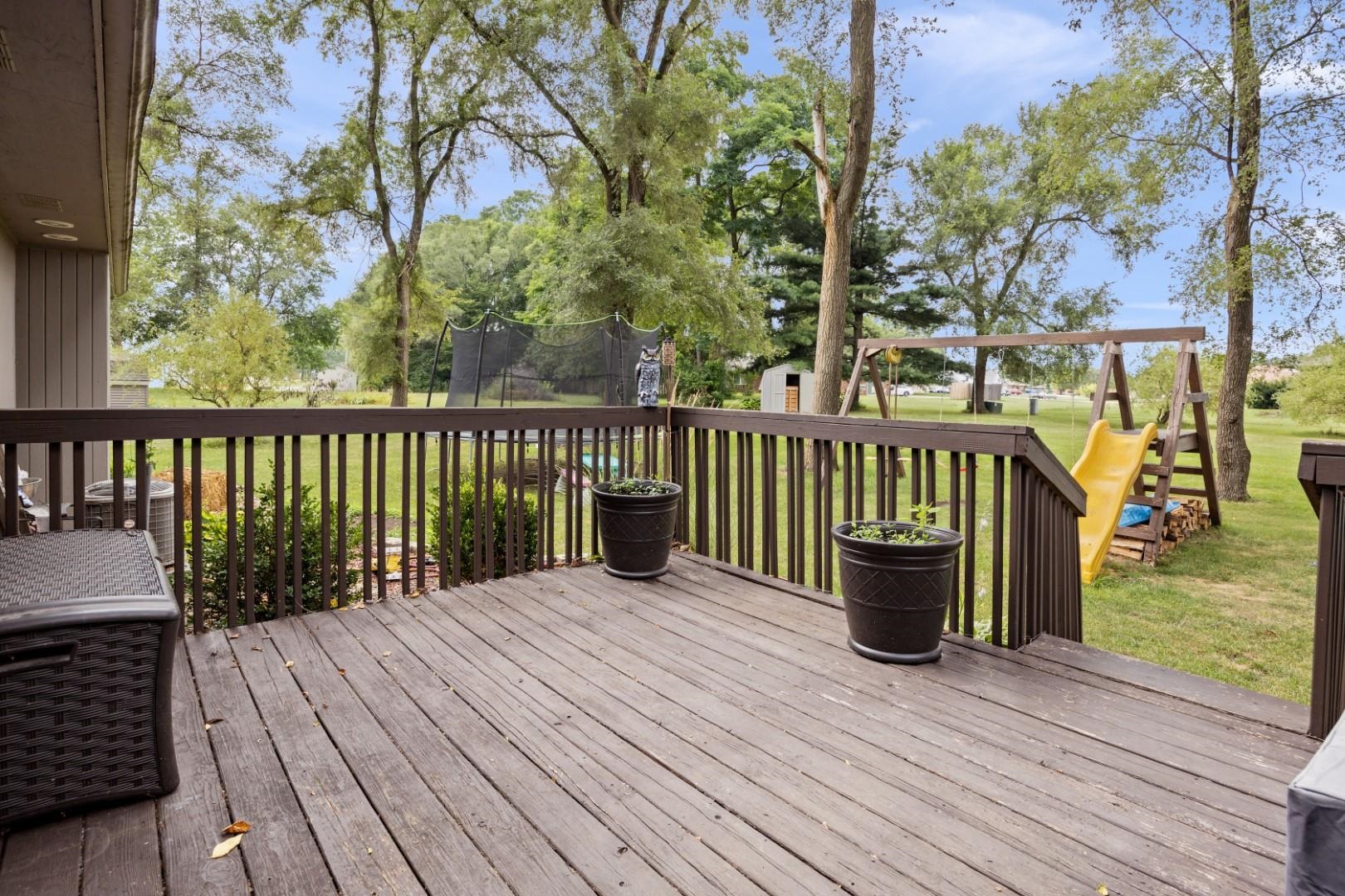 5568 Gray Eagle Road Roscoe, IL 61073 - Photo 35 of 45 a view of balcony with wooden floor and fence