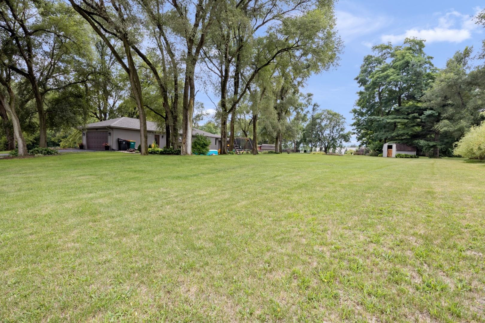 5568 Gray Eagle Road Roscoe, IL 61073 - Photo 37 of 45 a house with trees in front of it