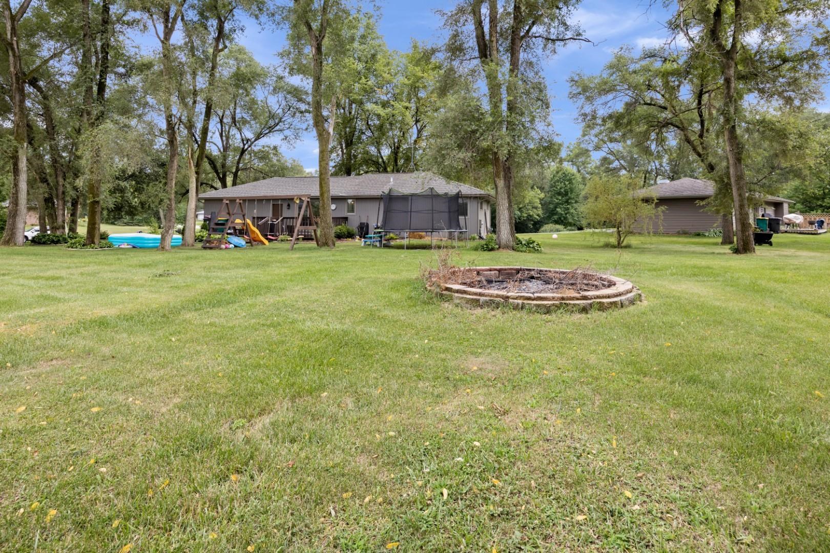 5568 Gray Eagle Road Roscoe, IL 61073 - Photo 38 of 45 a front view of a house with garden