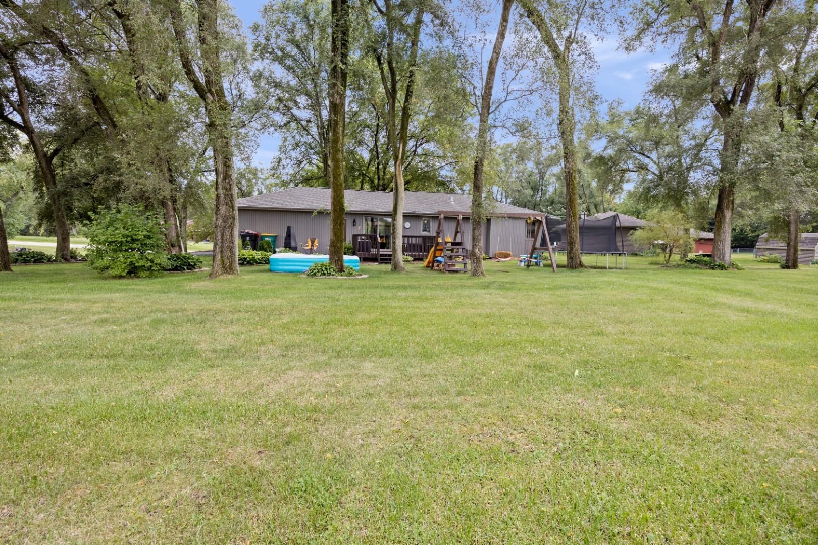 5568 Gray Eagle Road Roscoe, IL 61073 - Photo 39 of 45 a view of a park with large trees