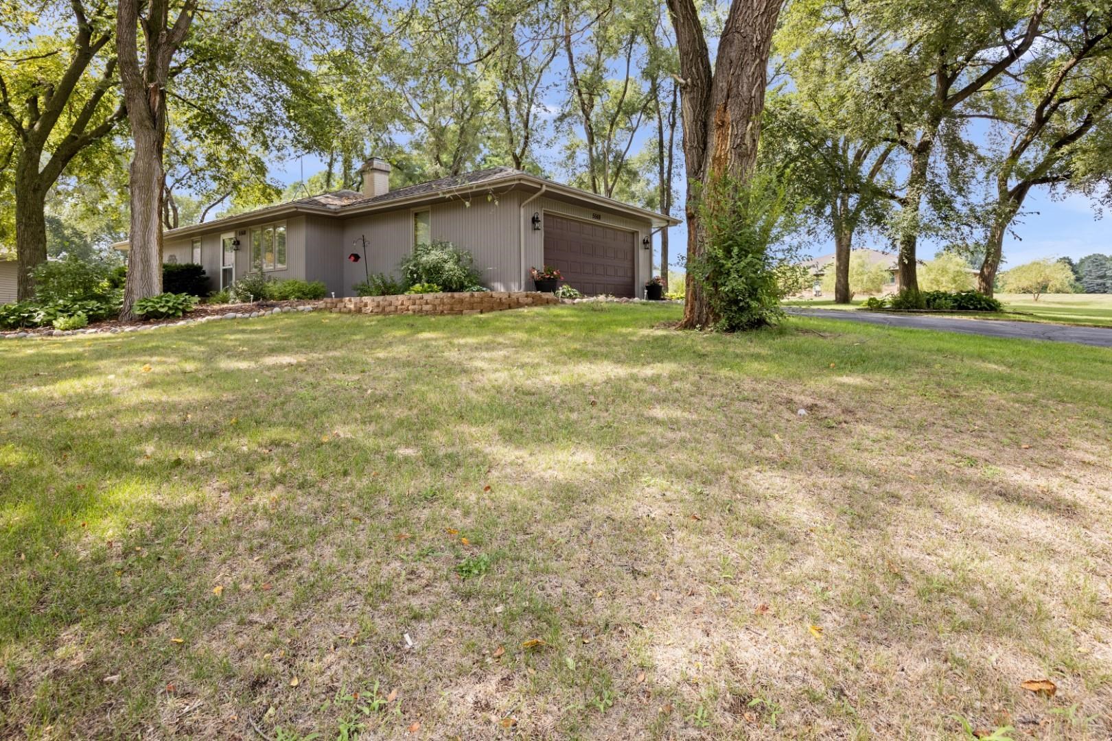 5568 Gray Eagle Road Roscoe, IL 61073 - Photo 43 of 45 a front view of a house with a yard