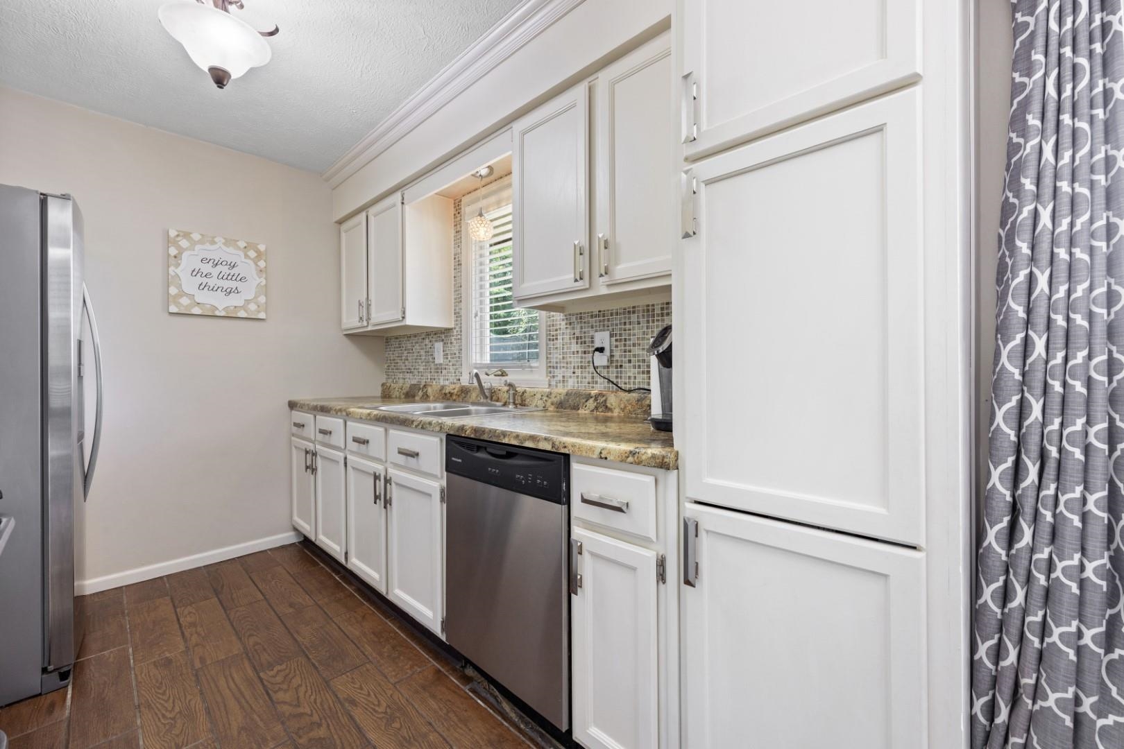 5568 Gray Eagle Road Roscoe, IL 61073 - Photo 6 of 45 a kitchen with stainless steel appliances granite countertop a refrigerator and a sink