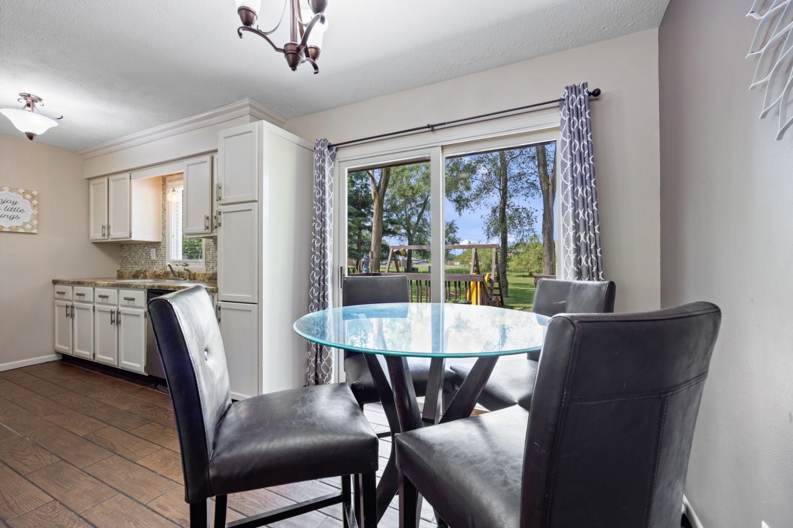 5568 Gray Eagle Road Roscoe, IL 61073 - Photo 7 of 45 a dining room with furniture and window