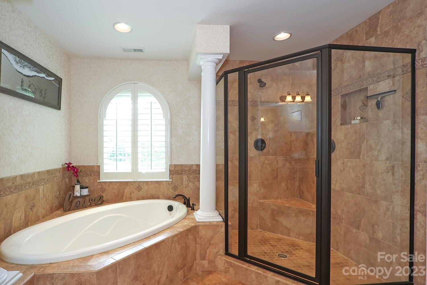 209 Fischer Road Fort Mill, SC 29715 - Photo 22 of 36 a bathroom with a tub a sink and a shower