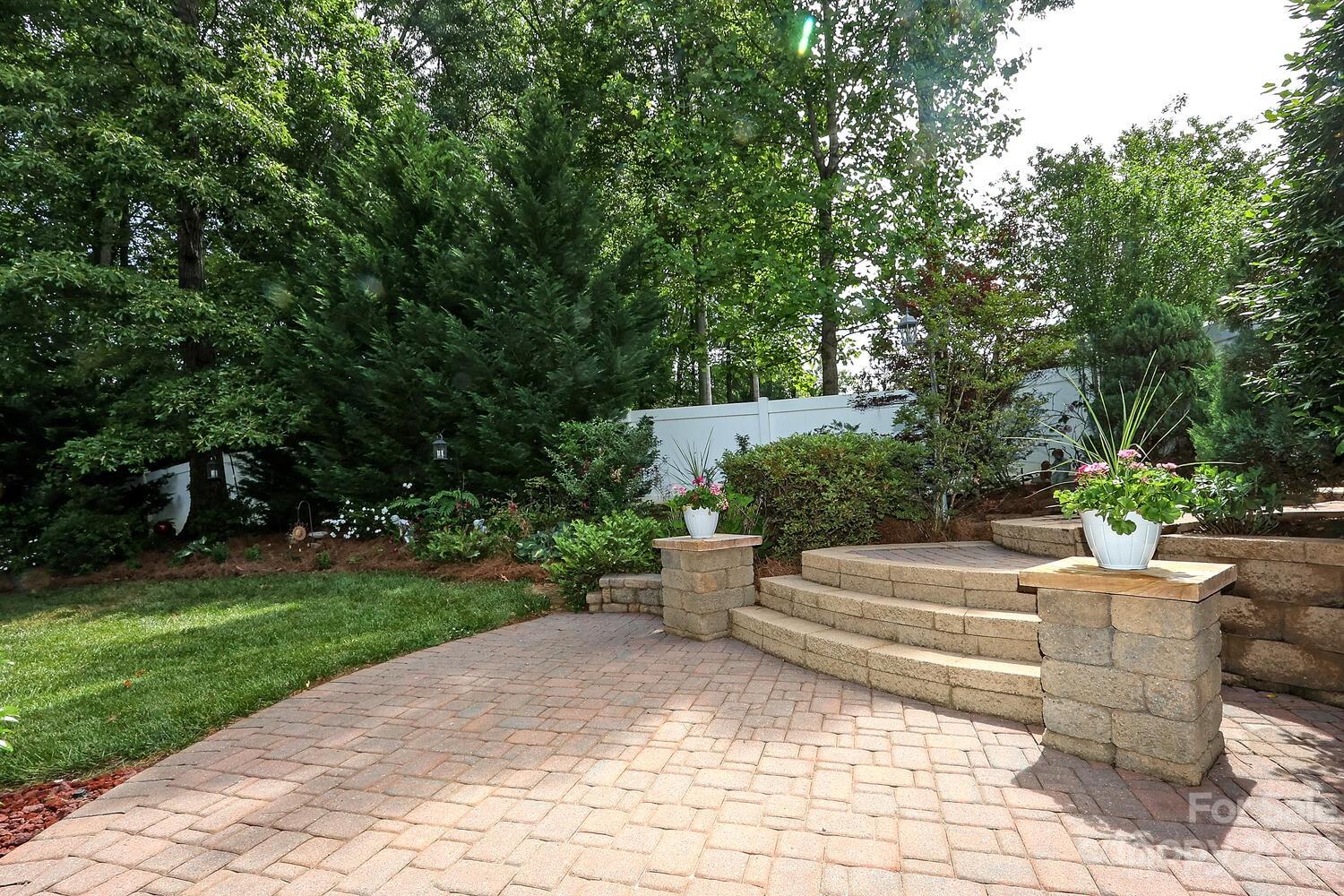 209 Fischer Road Fort Mill, SC 29715 - Photo 33 of 36 a view of a chair and tables in the garden