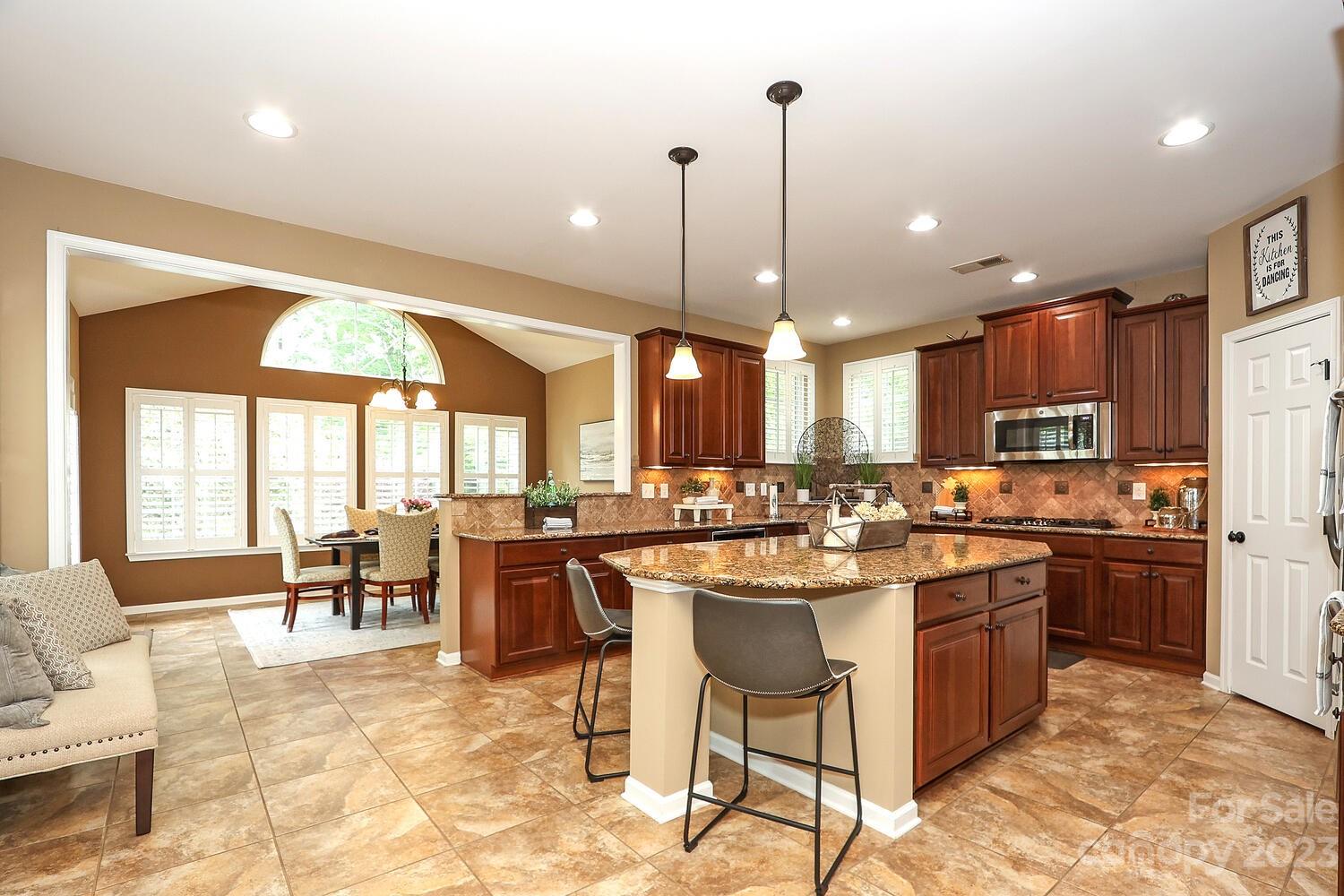 209 Fischer Road Fort Mill, SC 29715 - Photo 10 of 36 a kitchen with lots of counter top space and appliances