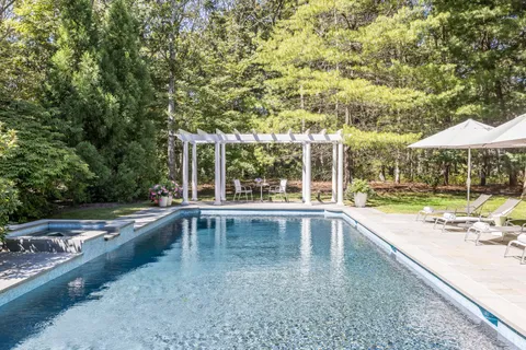 a view of a swimming pool with a patio