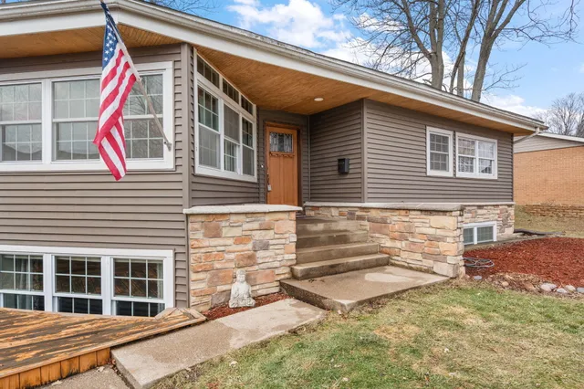 a view of house with a roof deck