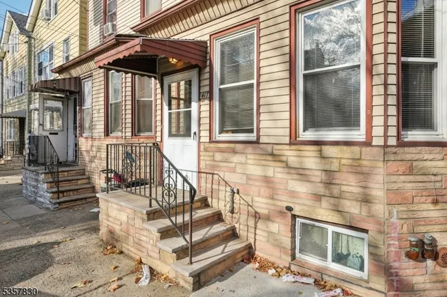 an outdoor view of a house with a porch