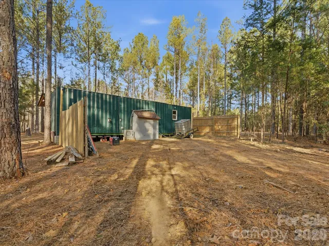 a view of a park with large trees
