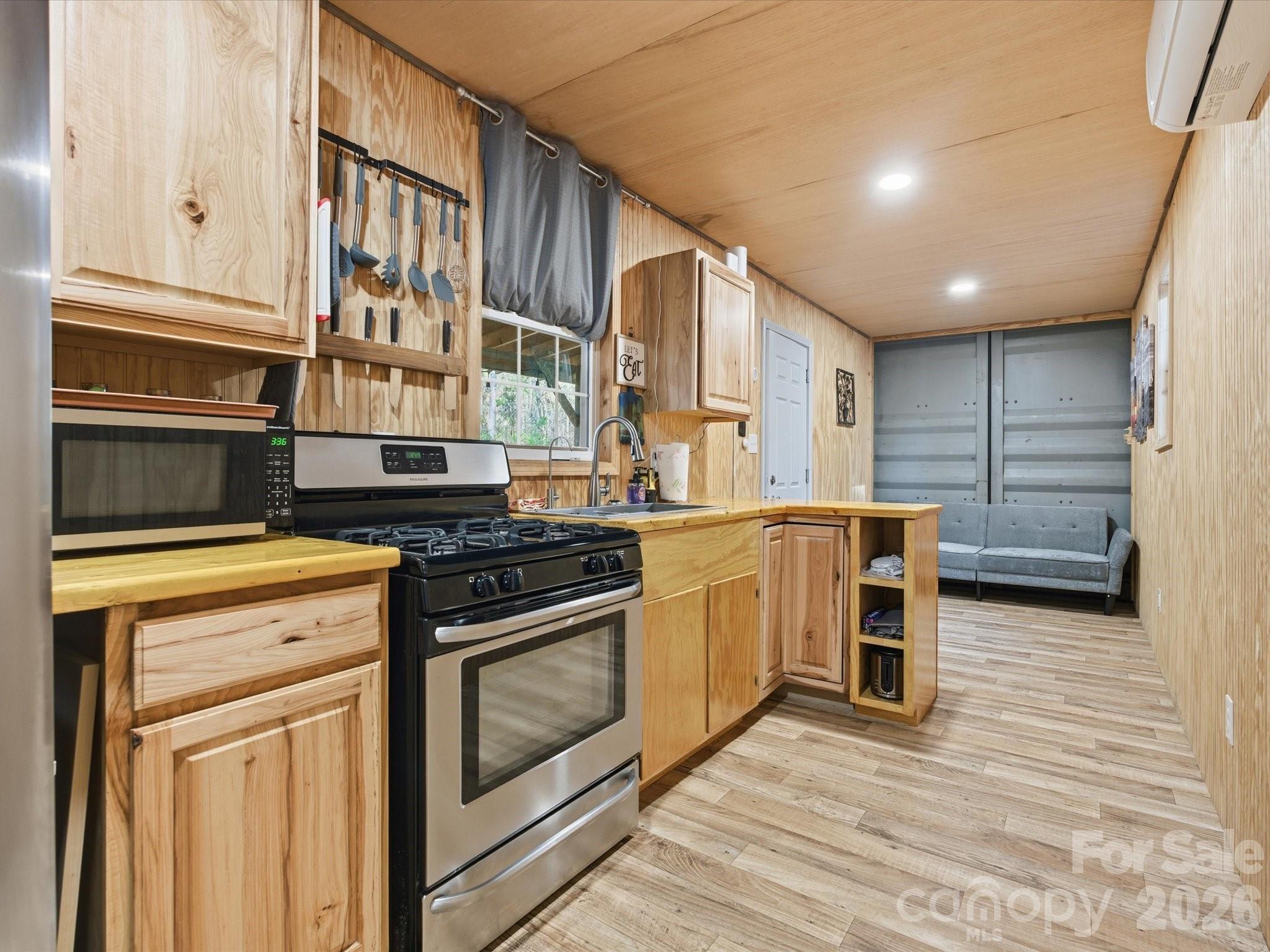 2704 Kee-Moore Drive Chester, SC 29706 - Photo 36 of 43 a kitchen with stainless steel appliances granite countertop a stove and a sink