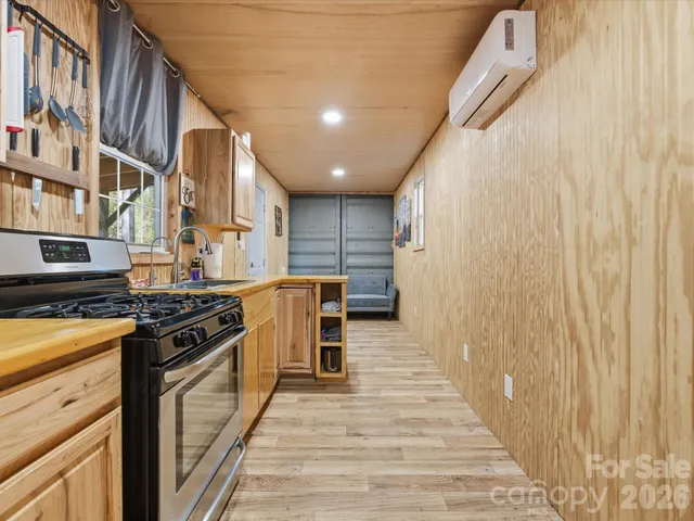 a kitchen with stainless steel appliances granite countertop a stove and a refrigerator