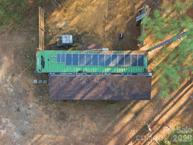a wooden bench sitting in front of a building