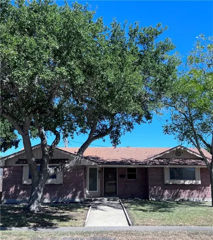 front view of a house with a garden