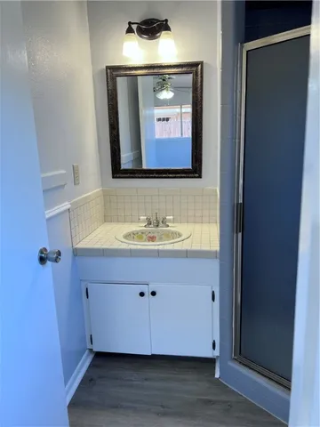 a bathroom with a sink and a mirror