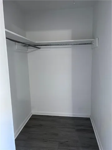 a view of an empty walk in closet