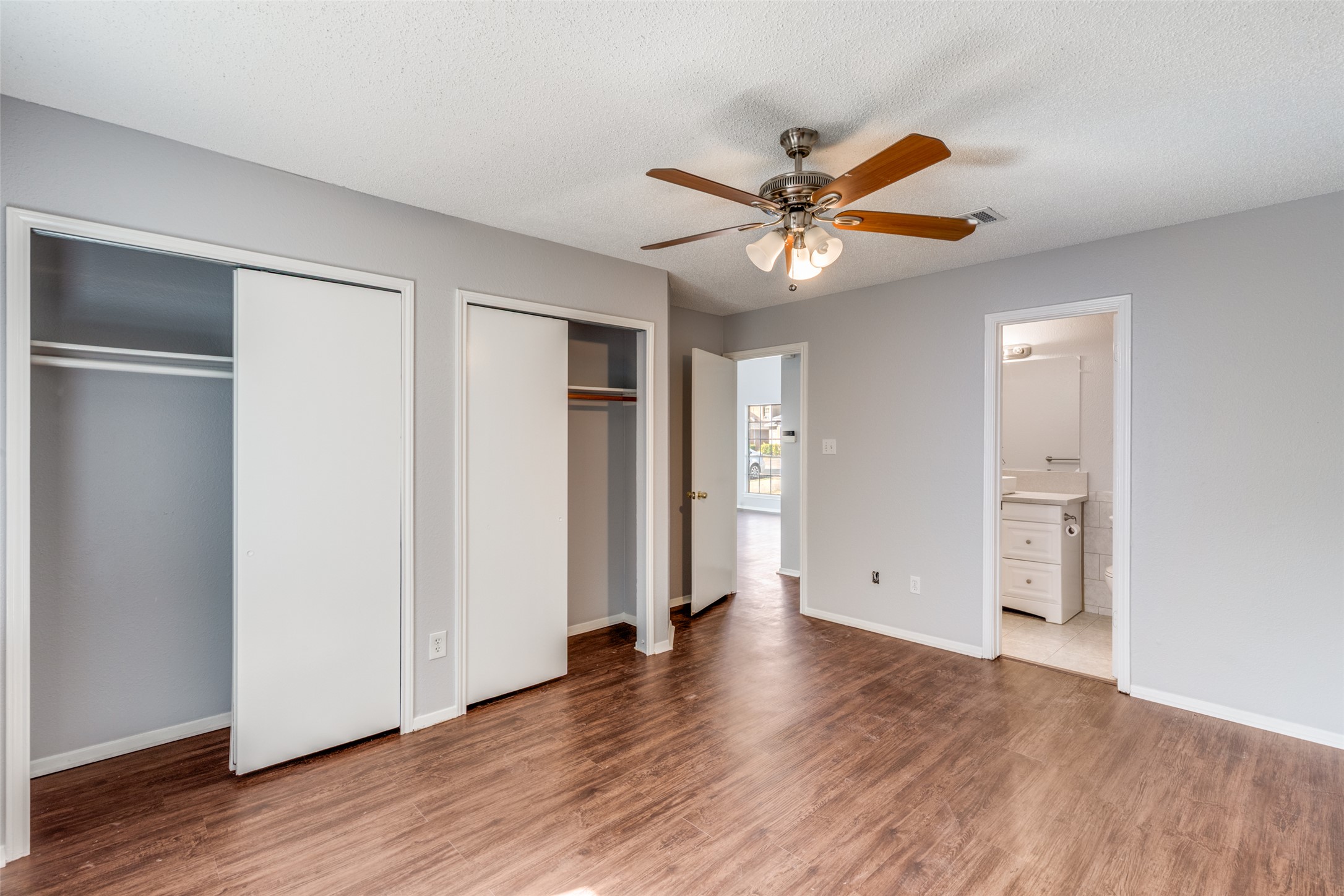 12323 Little Emily Way Austin, TX 78753 - Photo 14 of 24 a view of an empty room with wooden floor