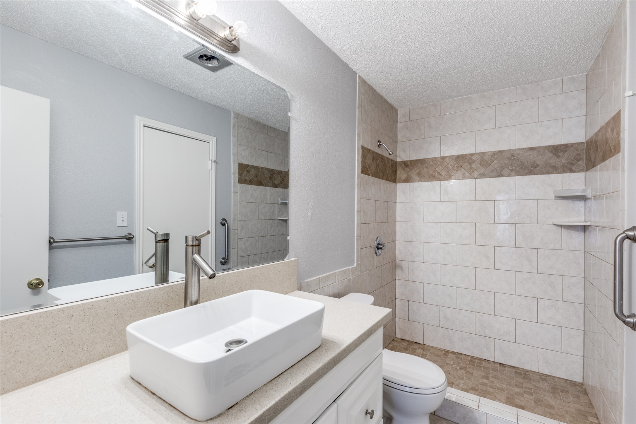 12323 Little Emily Way Austin, TX 78753 - Photo 15 of 24 a bathroom with a sink toilet and shower