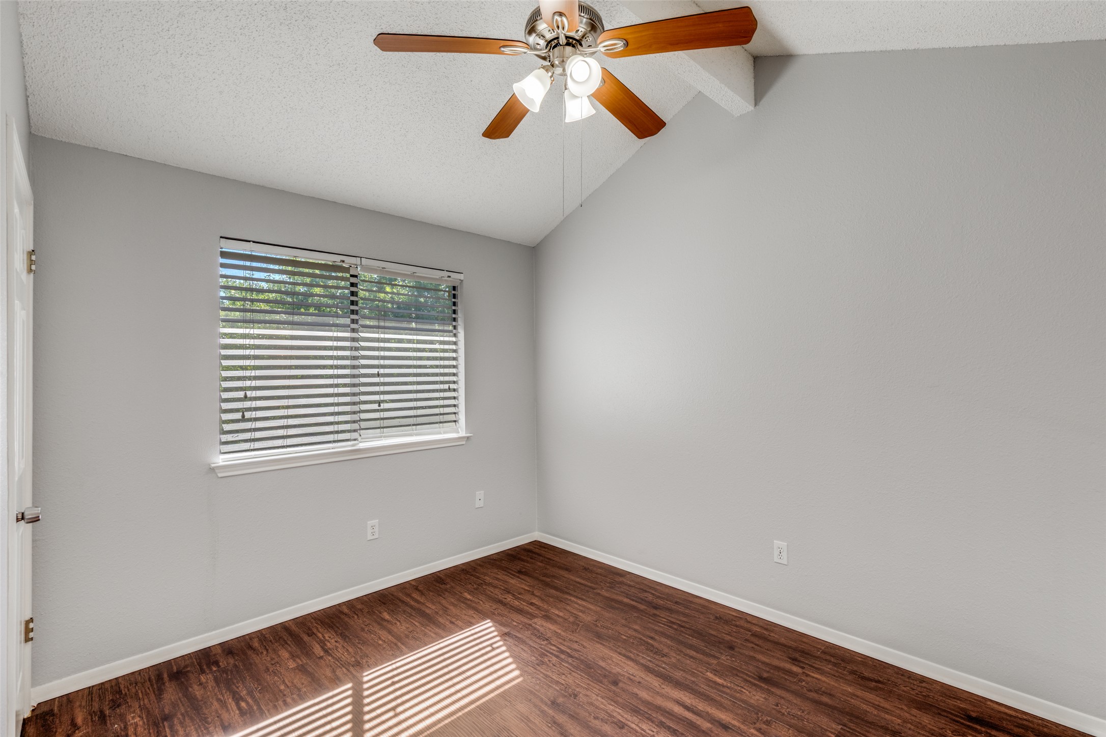 12323 Little Emily Way Austin, TX 78753 - Photo 16 of 24 a view of an empty room with window and wooden floor