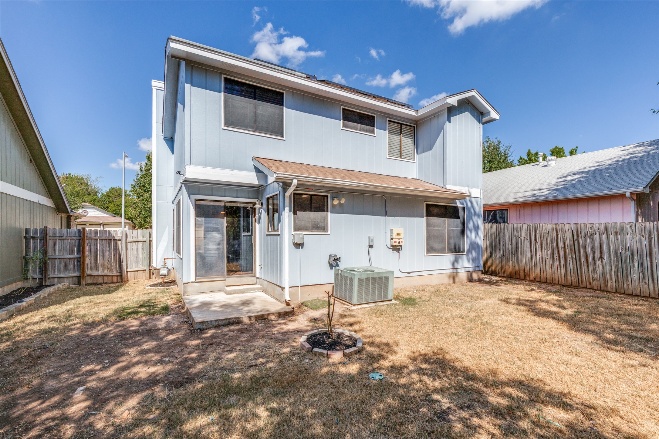 12323 Little Emily Way Austin, TX 78753 - Photo 23 of 24 a front view of a house with a yard outdoor seating and garage