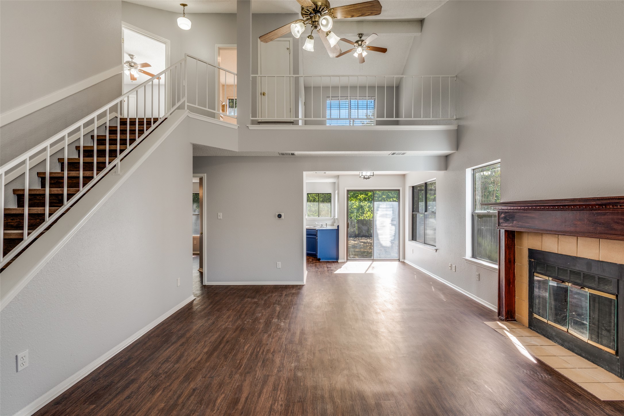 12323 Little Emily Way Austin, TX 78753 - Photo 7 of 24 a view of an room with wooden floor fireplace and windows