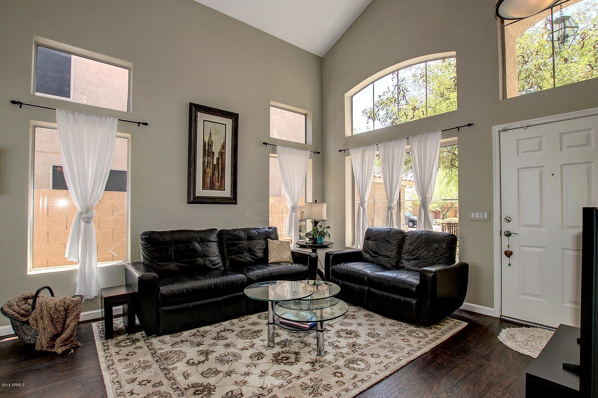 462 West Colt Road Tempe, AZ 85284 - Photo 2 of 29 a living room with furniture and a large window