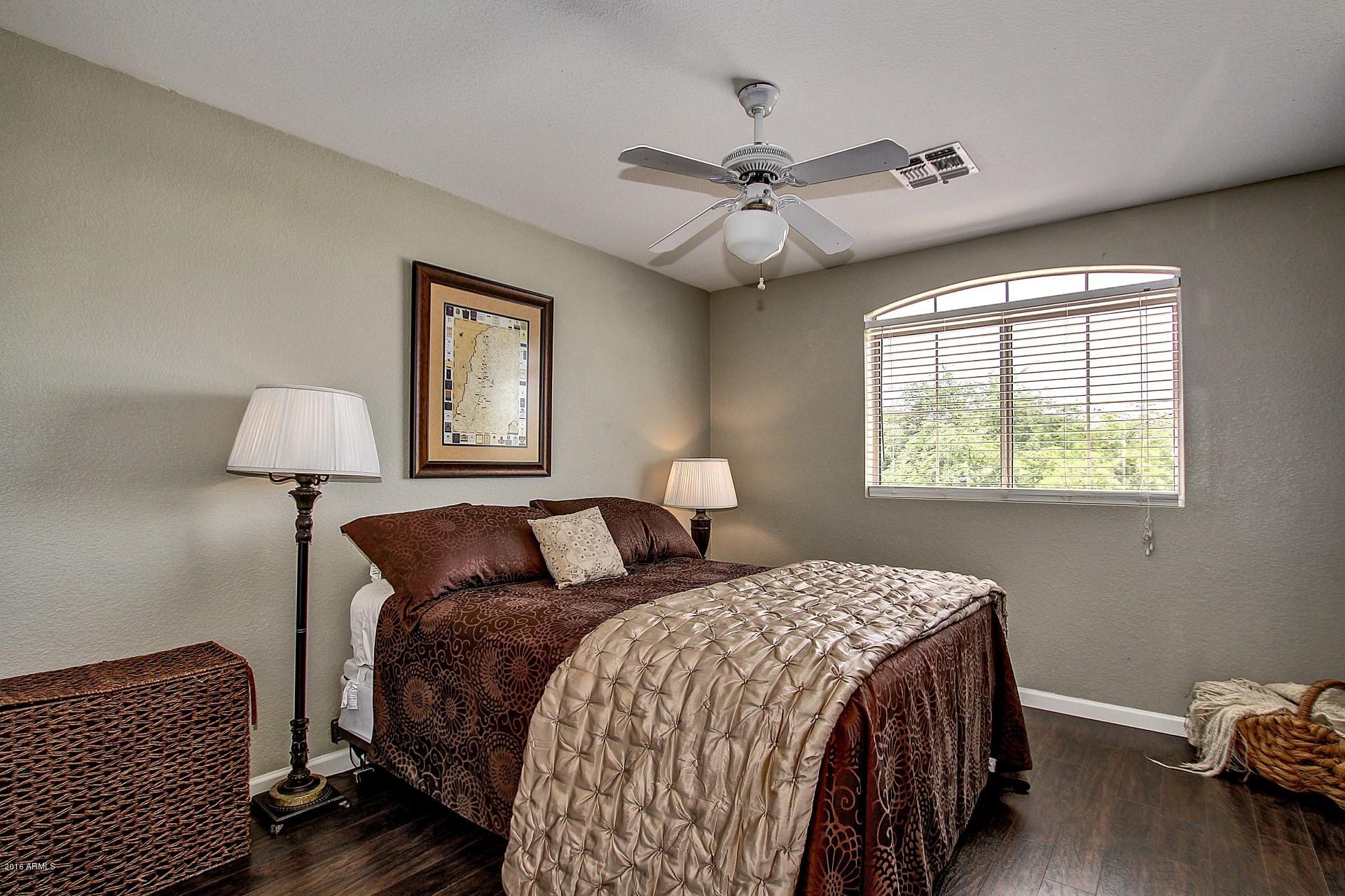 462 West Colt Road Tempe, AZ 85284 - Photo 23 of 29 a bedroom with a large bed and a window