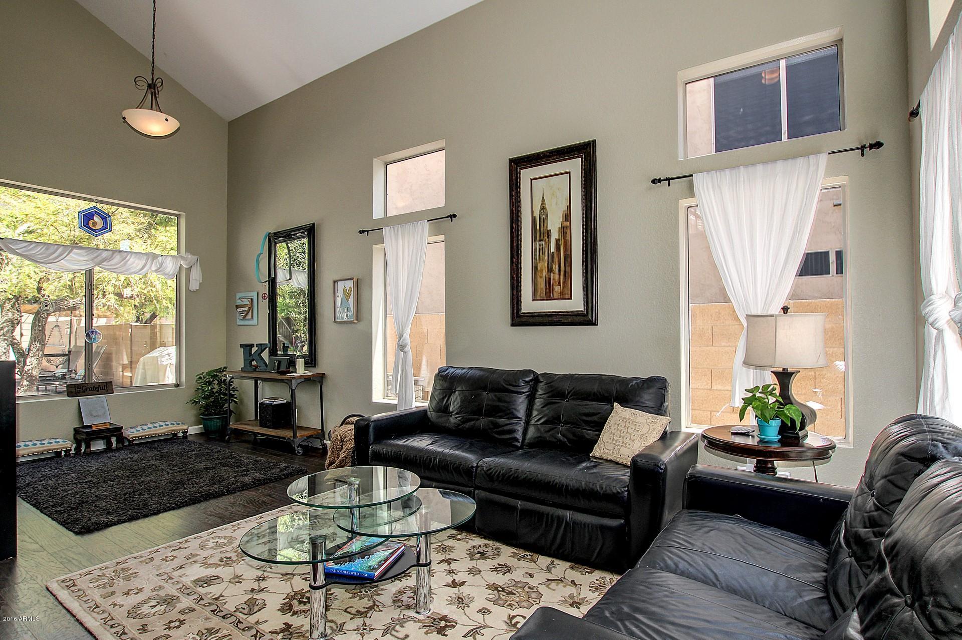 462 West Colt Road Tempe, AZ 85284 - Photo 3 of 29 a living room with furniture and a potted plant