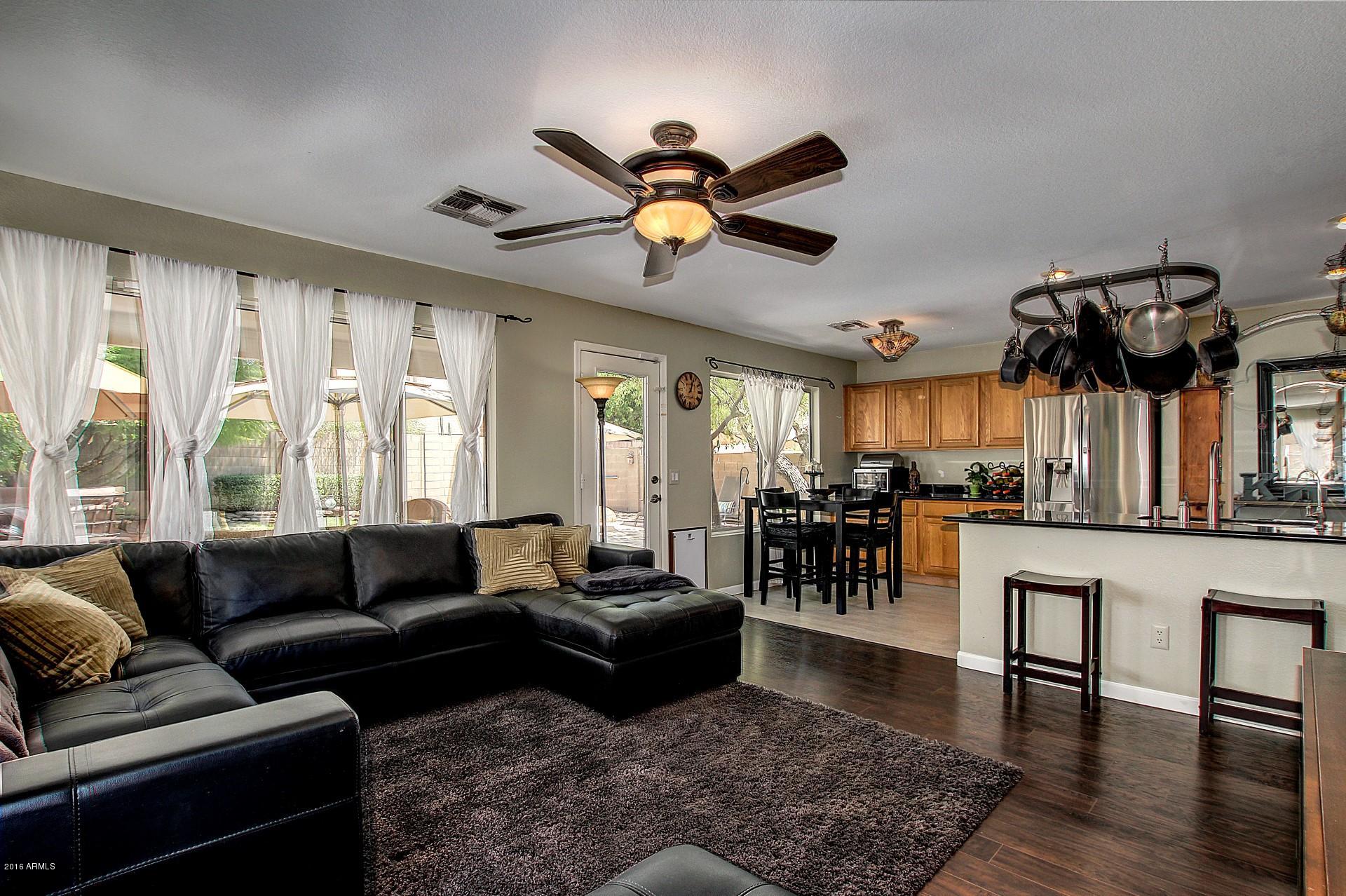 462 West Colt Road Tempe, AZ 85284 - Photo 9 of 29 a living room with lots of furniture and a large window