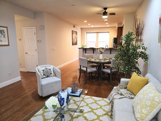 a view of a dining table and chairs in the patio