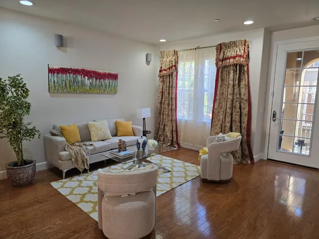 a living room with furniture and a large window