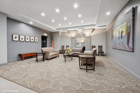a living room with furniture and a rug