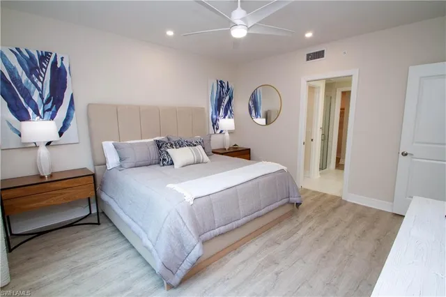 a bedroom with a bed and a dresser in it