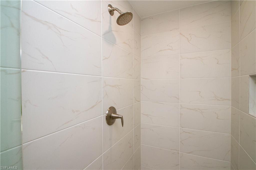 268 Indies Drive East, Unit 102 Naples, FL 34114 - Photo 25 of 48 a close up of a shower