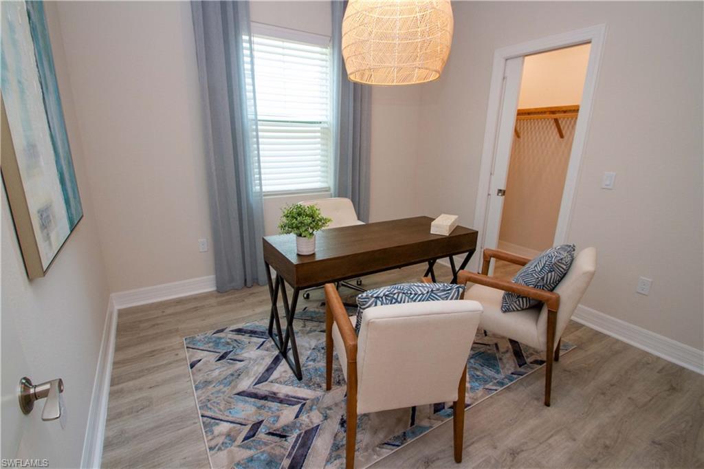 268 Indies Drive East, Unit 102 Naples, FL 34114 - Photo 32 of 48 a dining room with furniture and window