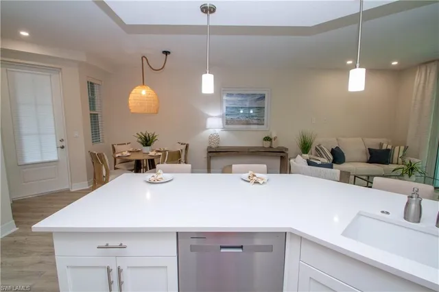 a kitchen with a sink and a refrigerator